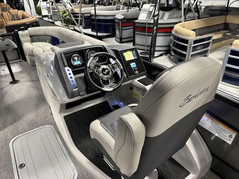 Slide: The Image of 2025 Barletta Lusso L25-UCA boat interior with modern dashboard and seating. - 8