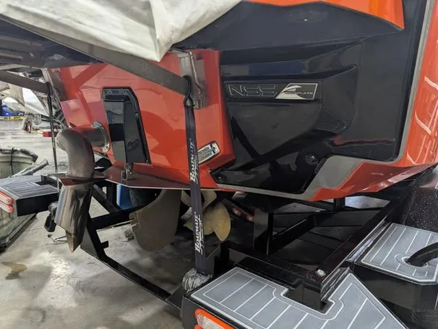 Slide: The Image of 2020 Nautique G23 Paragon boat on trailer, showcasing propeller and NSS system. - 19