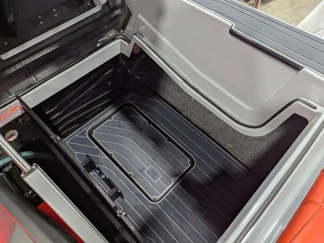 Slide: The Image of 2020 Nautique G23 Paragon storage compartment with sleek design and ample space. - 26