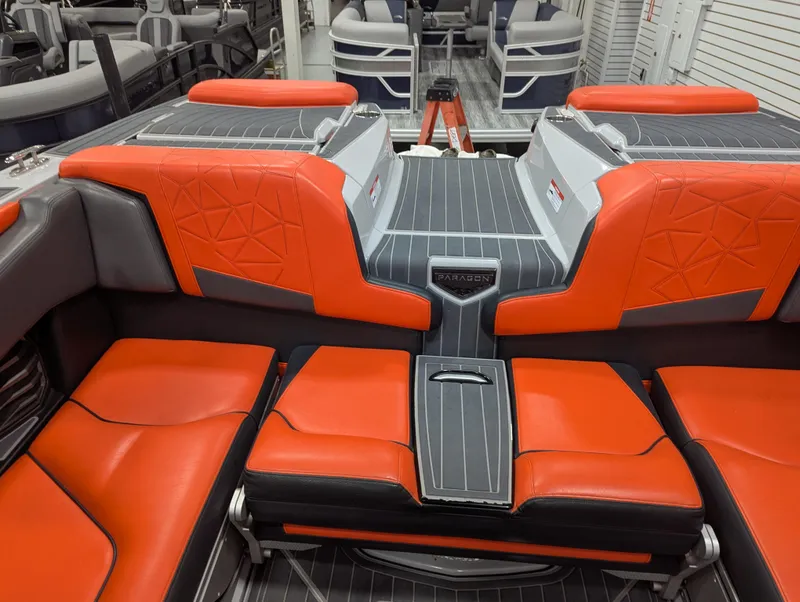 Slide: The Image of 2020 Nautique G23 Paragon interior with red and gray seating, showcasing luxury design. - 35
