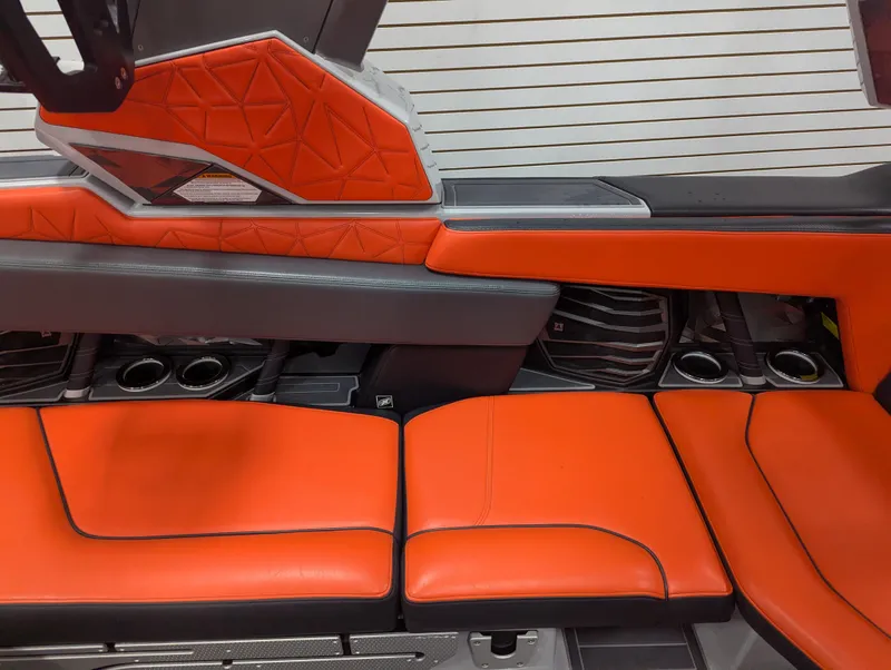 Slide: The Image of 2020 Nautique G23 Paragon interior with vibrant orange upholstery and sleek design elements. - 37