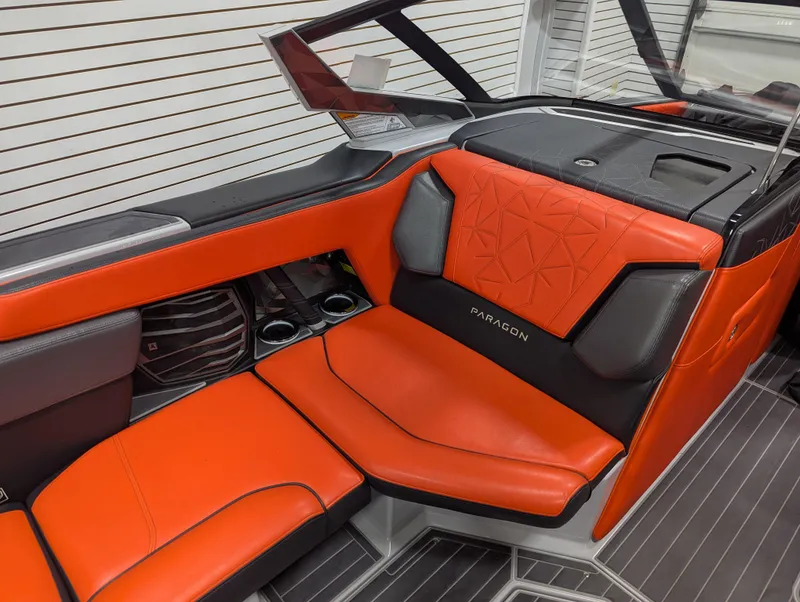 Slide: The Image of 2020 Nautique G23 Paragon interior with orange and black seating, modern design. - 42