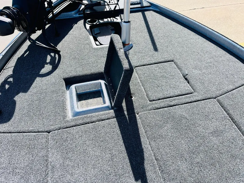 Slide: The Image of 2025 Nitro Z21 XL Pro boat deck with storage compartments and fishing equipment. - 15