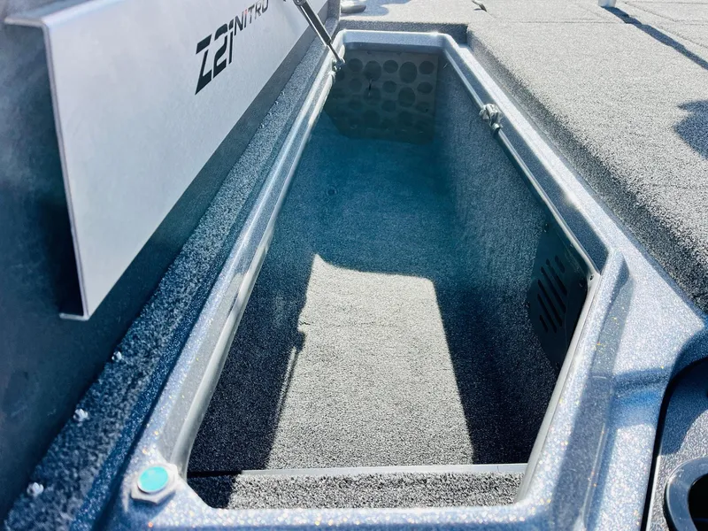 Slide: The Image of 2025 Nitro Z21 XL Pro boat storage compartment, open and empty. - 20