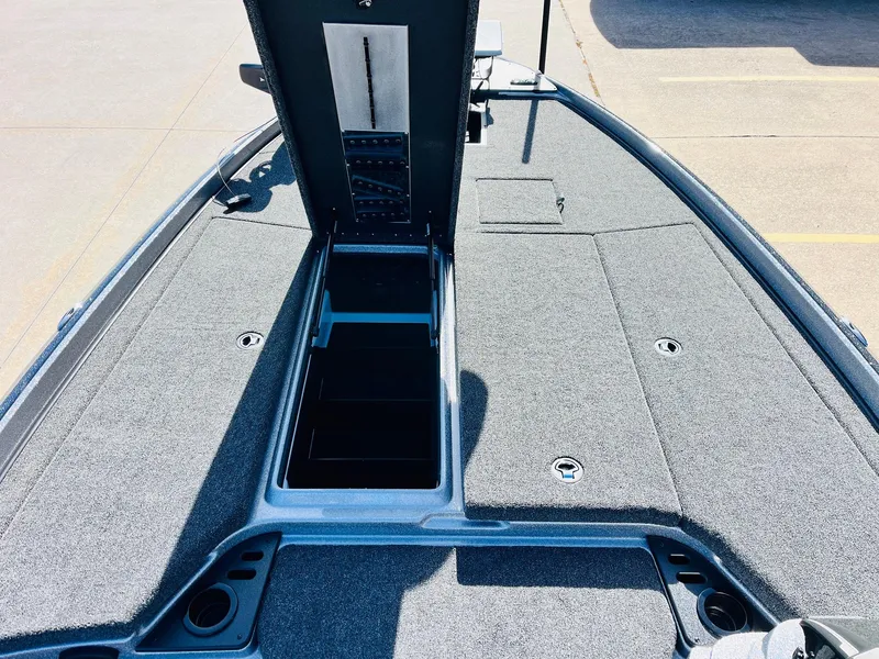 Slide: The Image of 2025 Nitro Z21 XL Pro boat deck with open storage compartment. - 22