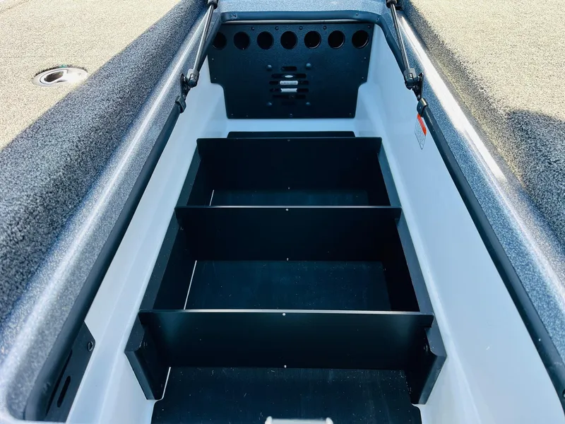 Slide: The Image of 2025 Nitro Z21 XL Pro boat storage compartment with dividers. - 23