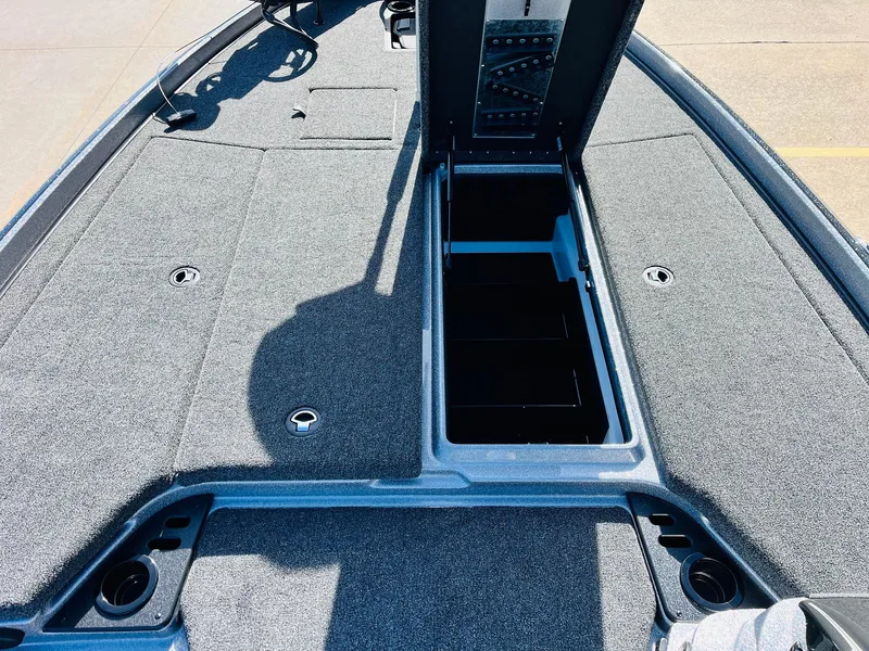 Slide: The Image of 2025 Nitro Z21 XL Pro boat deck with open storage compartment. - 24
