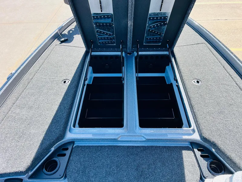 Slide: The Image of 2025 Nitro Z21 XL Pro boat storage compartments open on deck. - 26