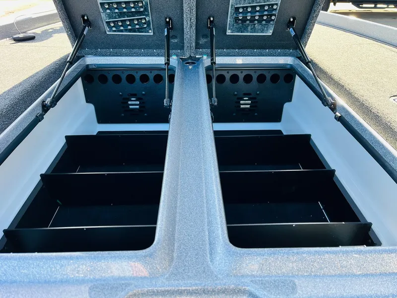 Slide: The Image of 2025 Nitro Z21 XL Pro boat storage compartments with organized shelving. - 27