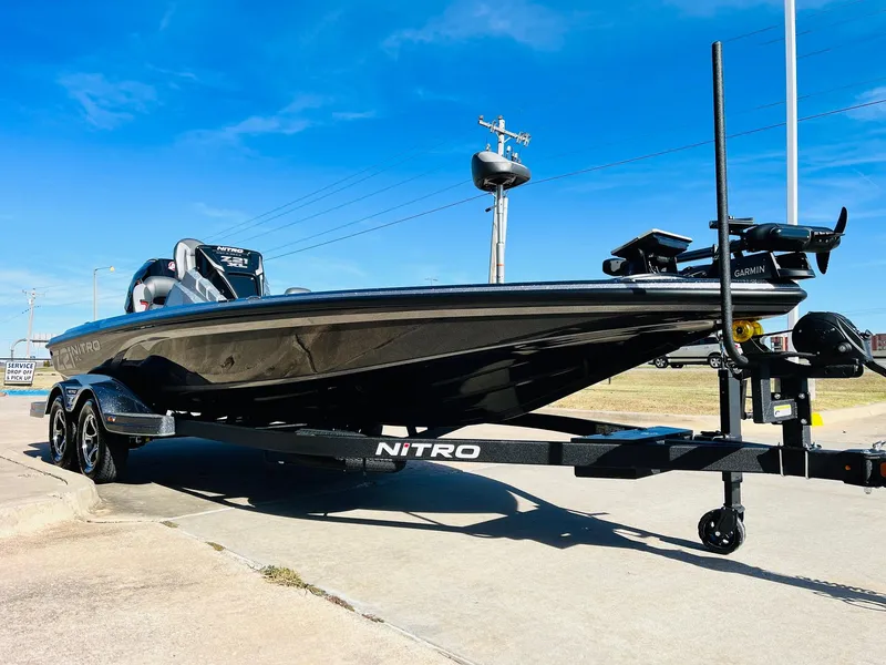 Slide: The Image of 2025 Nitro Z21 XL Pro boat on trailer under clear blue sky. - 3