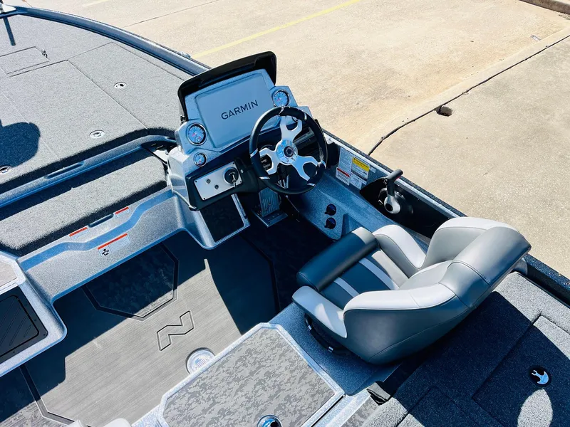 Slide: The Image of 2025 Nitro Z21 XL Pro boat cockpit with Garmin navigation system and comfortable seating. - 40