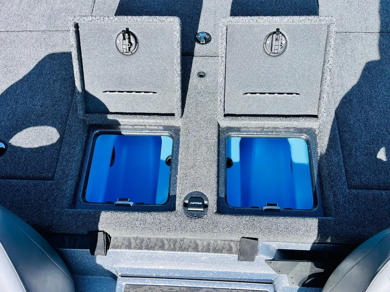 Slide: The Image of 2025 Nitro Z21 XL Pro boat storage compartments with open lids. - 45