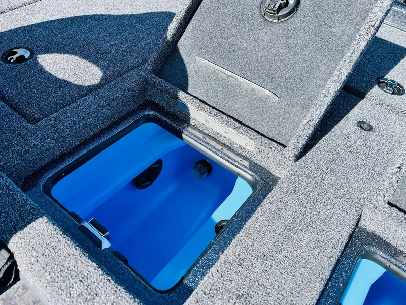Slide: The Image of 2025 Nitro Z21 XL Pro boat storage compartment with blue interior. - 46