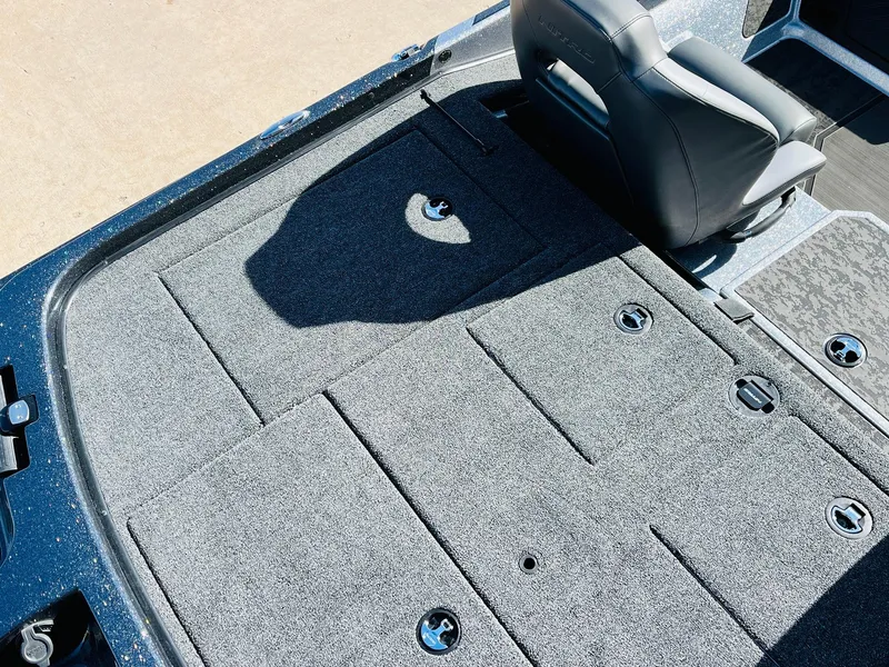 Slide: The Image of 2025 Nitro Z21 XL Pro boat deck with storage compartments and seating. - 49