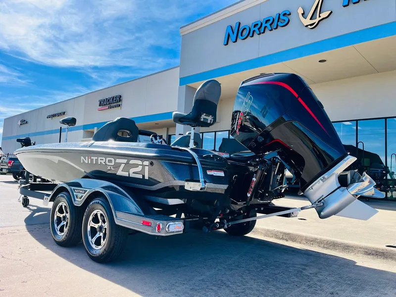 Slide: The Image of 2025 Nitro Z21 XL Pro boat displayed outside dealership. - 7