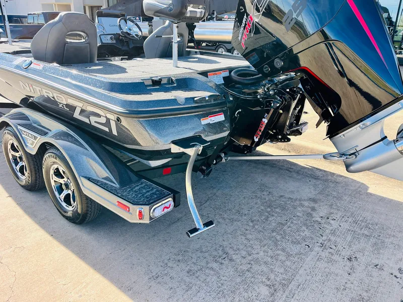 Slide: The Image of 2025 Nitro Z21 XL Pro boat on trailer, featuring sleek design and powerful engine. - 8