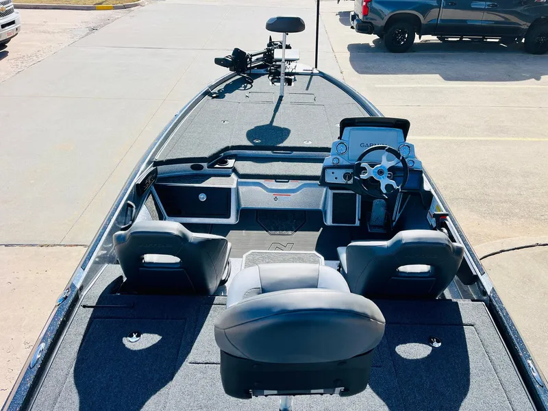 Slide: The Image of 2025 Nitro Z21 XL Pro boat interior with steering console and seating. - 9