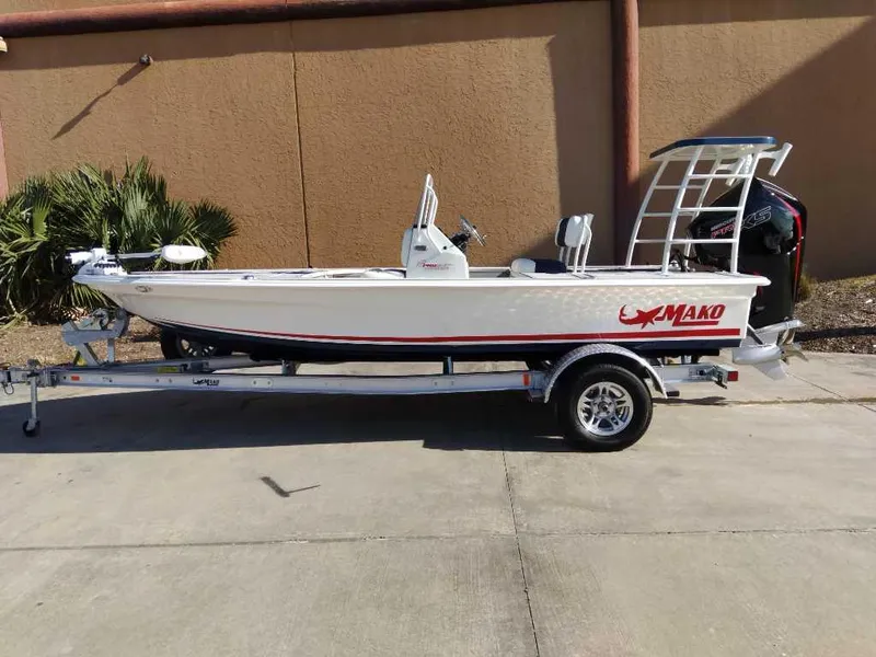 The Image of 2025 Mako 18 Pro Skiff Patriot Edition on trailer, side view. - 0