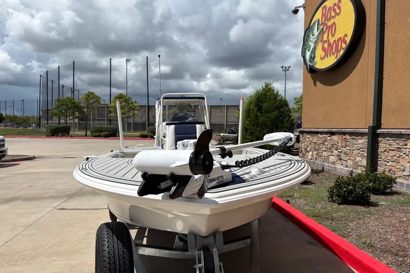 Slide: The Image of 2025 Mako 18 Pro Skiff Patriot Edition boat outside Bass Pro Shops. - 4