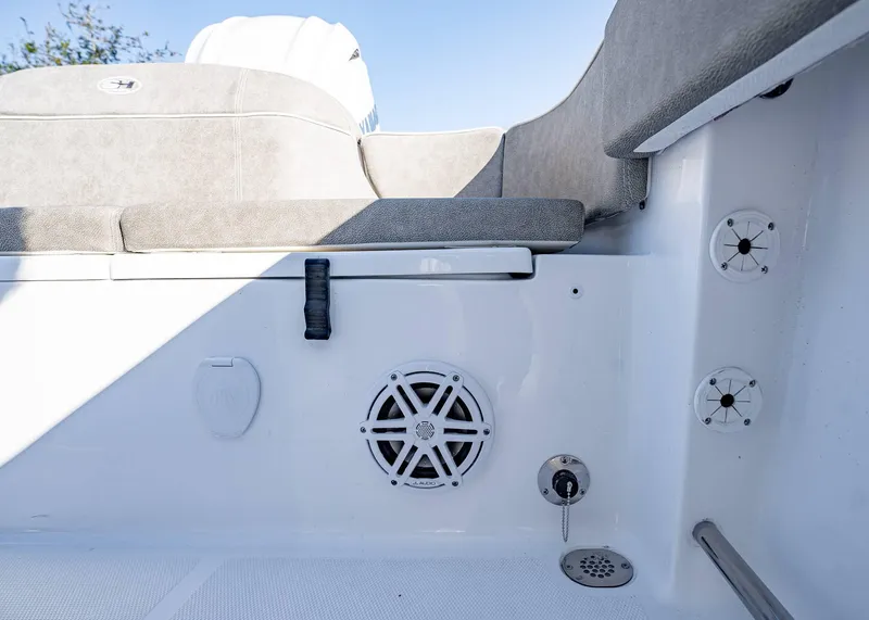 Slide: The Image of 2025 Sea Hunt Ultra 239 SE boat interior with speaker and seating. - 11