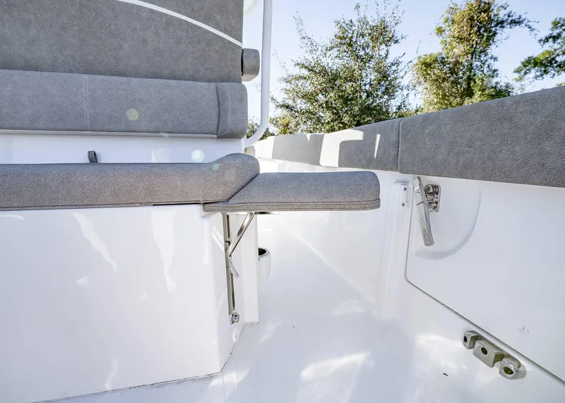 Slide: The Image of 2025 Sea Hunt Ultra 239 SE boat interior with foldable seating and sleek design. - 14