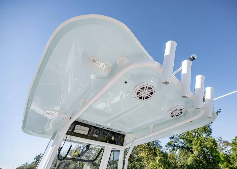 Slide: The Image of 2025 Sea Hunt Ultra 239 SE boat canopy with rod holders and speakers. - 17