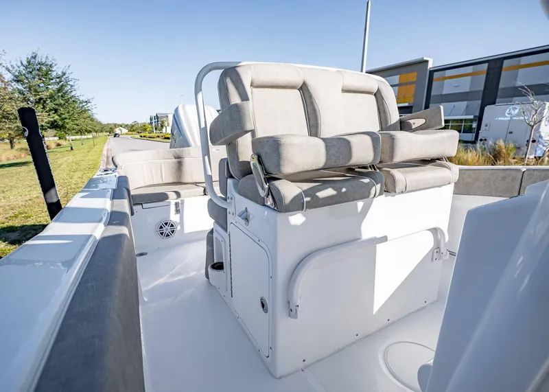 Slide: The Image of 2025 Sea Hunt Ultra 239 SE boat interior with cushioned seating and storage compartments. - 20