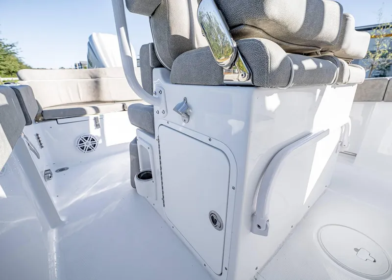 Slide: The Image of 2025 Sea Hunt Ultra 239 SE boat interior with cushioned seating and storage compartments. - 21