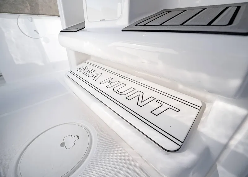 Slide: The Image of 2025 Sea Hunt Ultra 239 SE boat interior detail with logo. - 22