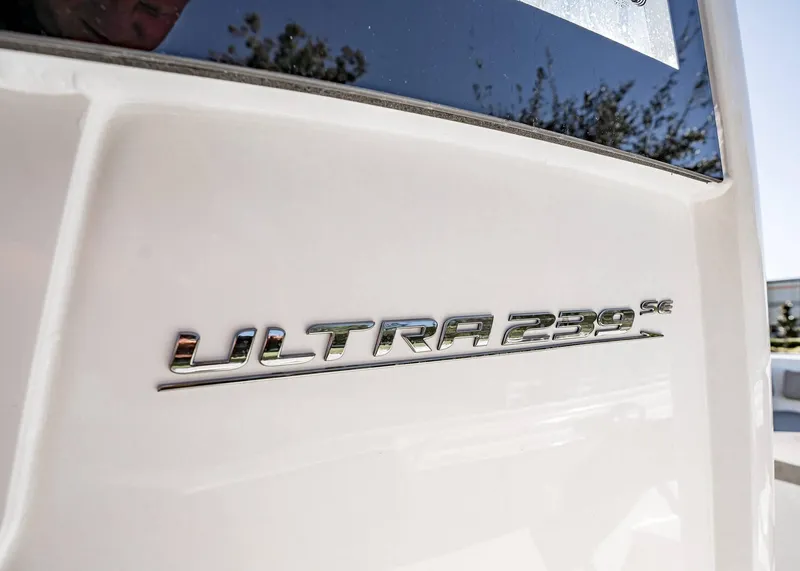 Slide: The Image of Close-up of 2025 Sea Hunt Ultra 239 SE boat logo. - 23