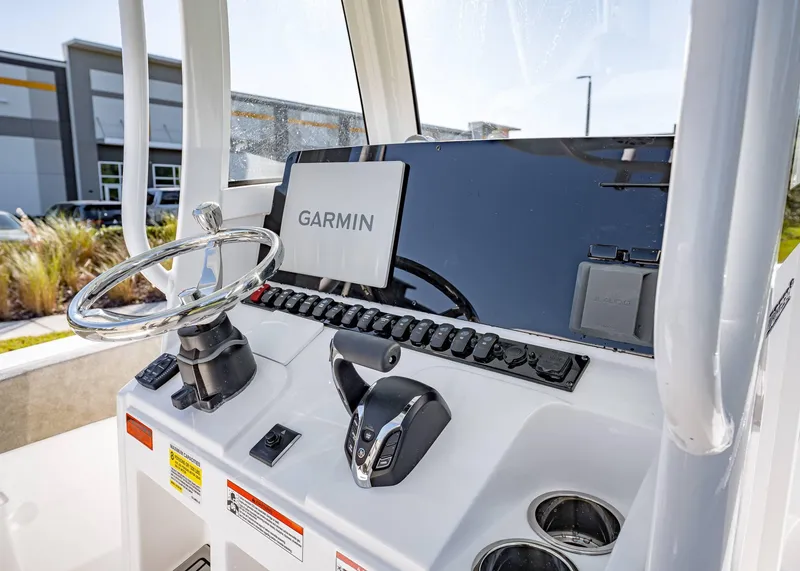 Slide: The Image of 2025 Sea Hunt Ultra 239 SE boat dashboard with Garmin navigation system. - 27