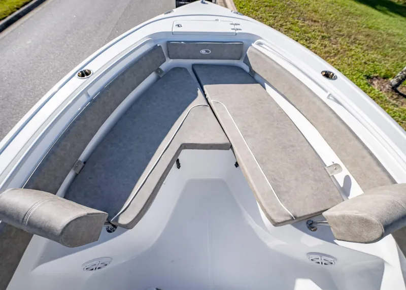 Slide: The Image of 2025 Sea Hunt Ultra 239 SE boat interior with cushioned seating and sleek design. - 34