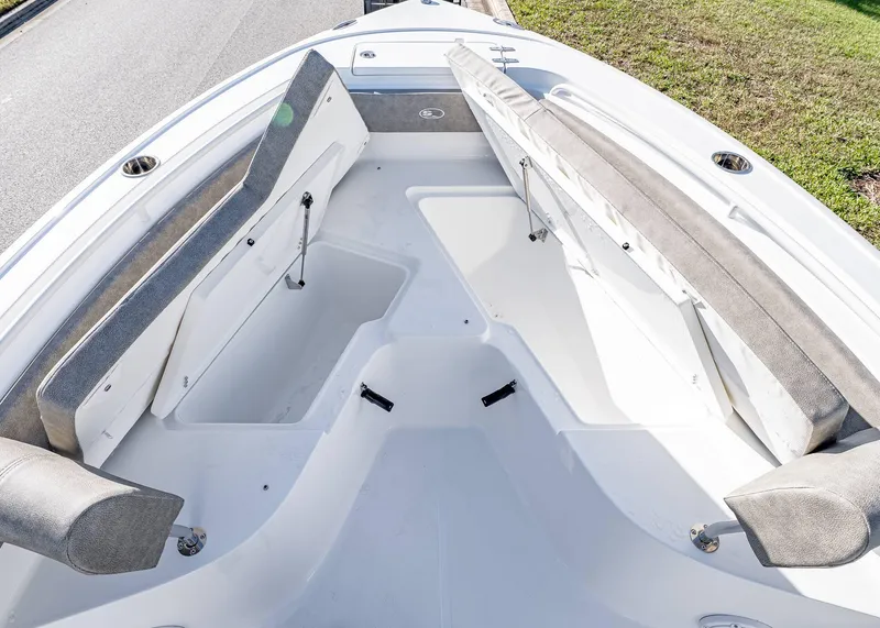 Slide: The Image of 2025 Sea Hunt Ultra 239 SE boat interior with spacious seating and storage compartments. - 35