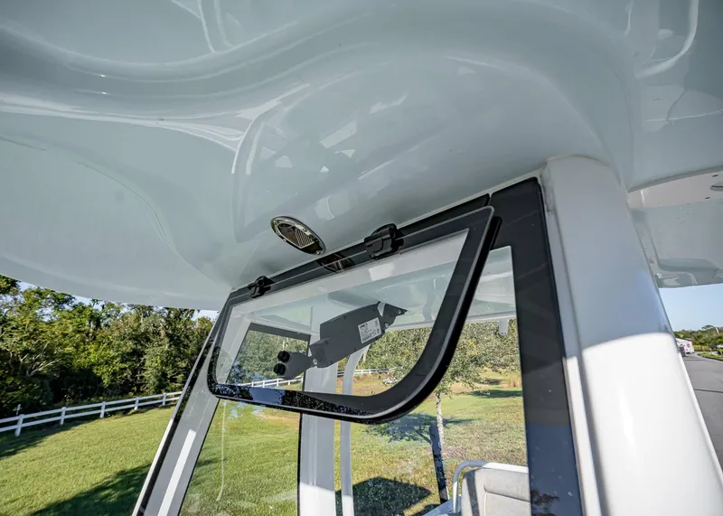 Slide: The Image of 2025 Sea Hunt Ultra 239 SE boat windshield and roof detail. - 37