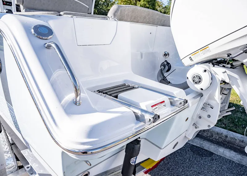 Slide: The Image of 2025 Sea Hunt Ultra 239 SE boat stern with swim platform and ladder. - 6