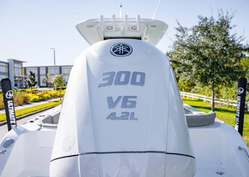 Slide: The Image of 2025 Sea Hunt Ultra 239 SE with 300 V6 4.2L engine, outdoor setting. - 9
