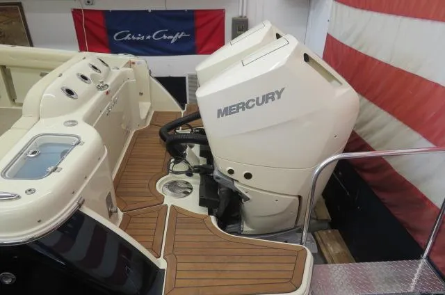 The Image of 2024 Chris-Craft Calypso 32 with Mercury outboard engines, featuring teak flooring. - 0