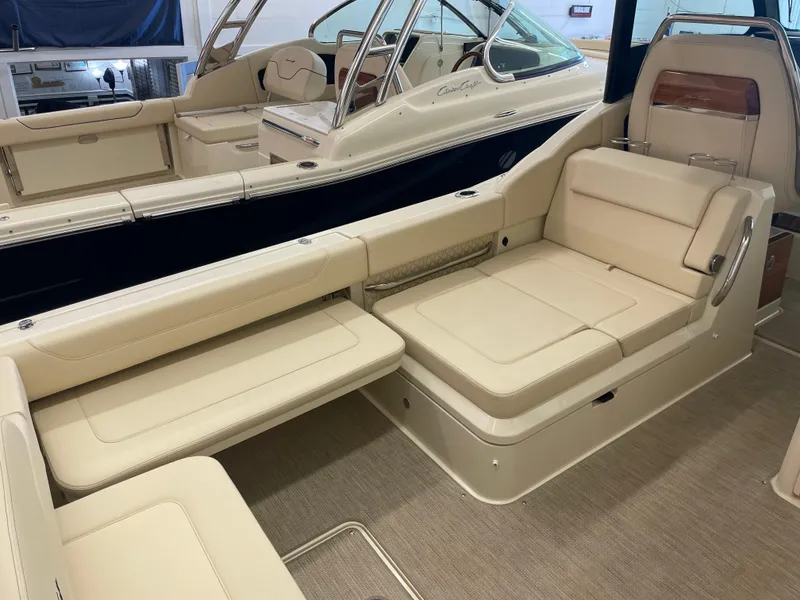 Slide: The Image of 2024 Chris-Craft Calypso 32 boat interior with beige seating and elegant design. - 10