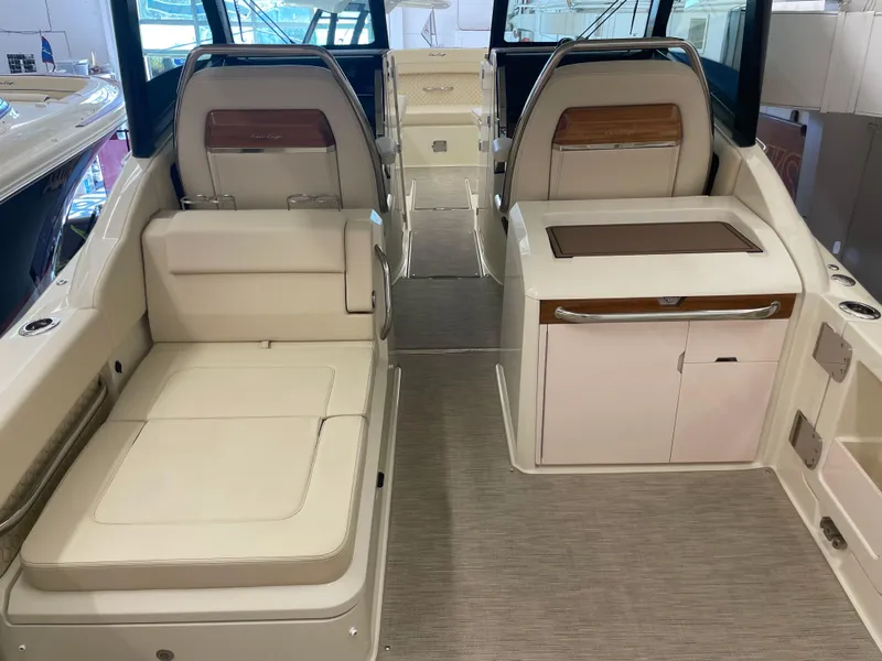 Slide: The Image of 2024 Chris-Craft Calypso 32 interior with luxurious seating and modern design. - 11