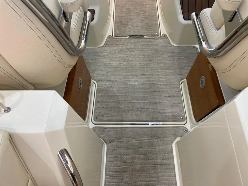 Slide: The Image of 2024 Chris-Craft Calypso 32 interior with elegant flooring and seating details. - 19