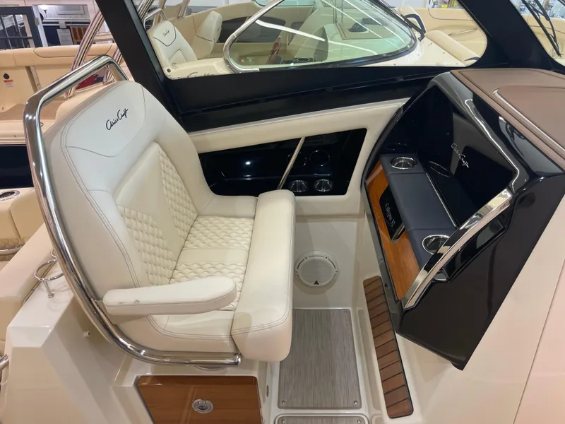 Slide: The Image of 2024 Chris-Craft Calypso 32 cockpit with luxurious seating and modern dashboard. - 24