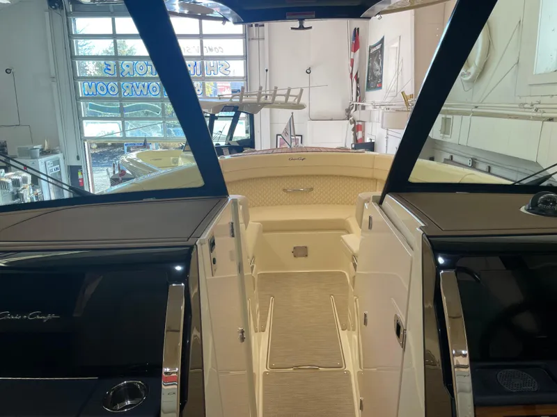 Slide: The Image of 2024 Chris-Craft Calypso 32 boat interior in showroom setting. - 27