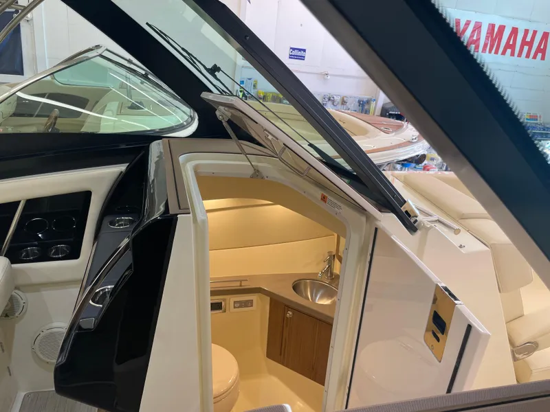 Slide: The Image of 2024 Chris-Craft Calypso 32 boat interior with cabin and sink. - 29
