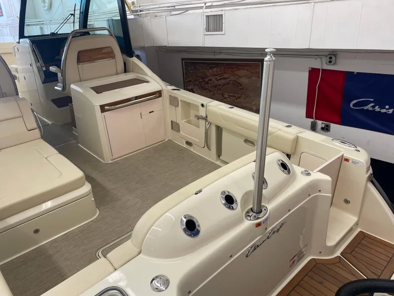 Slide: The Image of 2024 Chris-Craft Calypso 32 boat interior with seating and helm station. - 3