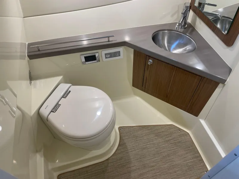 Slide: The Image of 2024 Chris-Craft Calypso 32 boat bathroom with modern sink and toilet. - 30