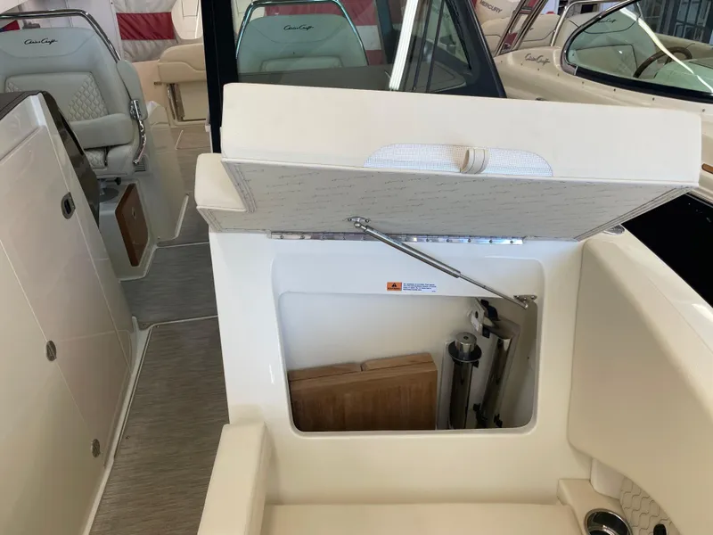 Slide: The Image of 2024 Chris-Craft Calypso 32 boat interior with open storage compartment. - 36