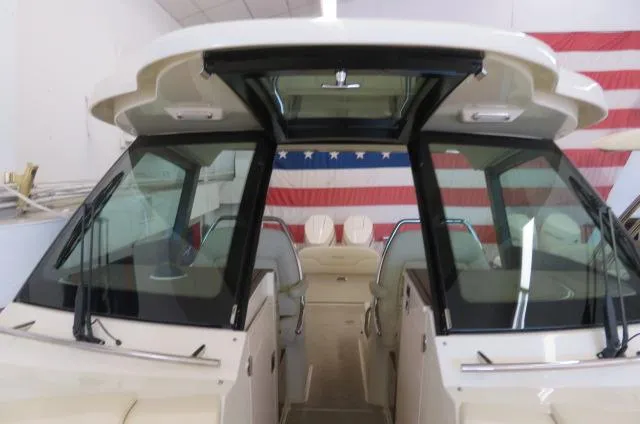 Slide: The Image of 2024 Chris-Craft Calypso 32 boat interior with American flag backdrop. - 39
