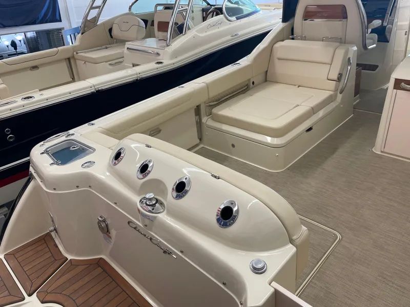 Slide: The Image of 2024 Chris-Craft Calypso 32 luxury boat interior with seating and control panel. - 4