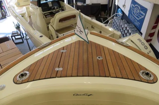 Slide: The Image of 2024 Chris-Craft Calypso 32 boat with teak deck and elegant interior. - 48