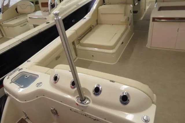 Slide: The Image of 2024 Chris-Craft Calypso 32 interior with beige seating and sleek design. - 5